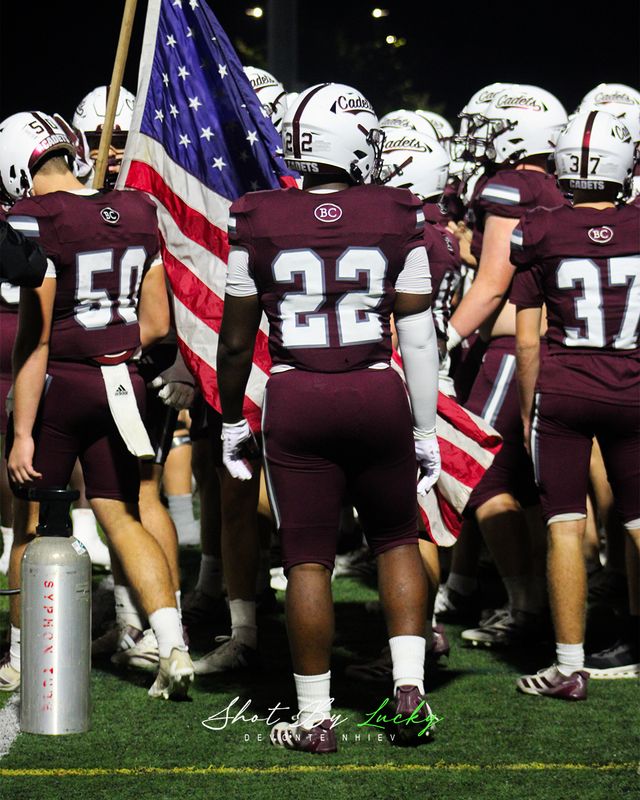 The team gathered behind the flag before kickoff