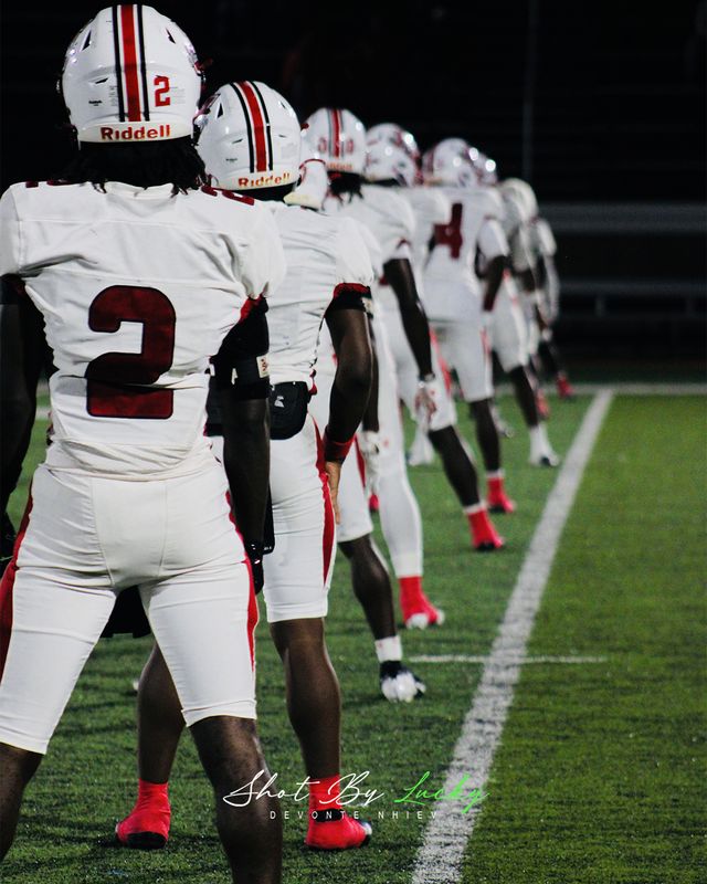 The defensive line strung out across the field, waiting