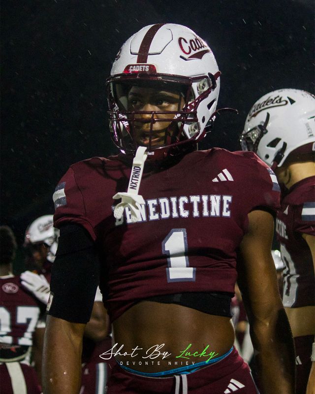 A player turning out of the pack under the lights