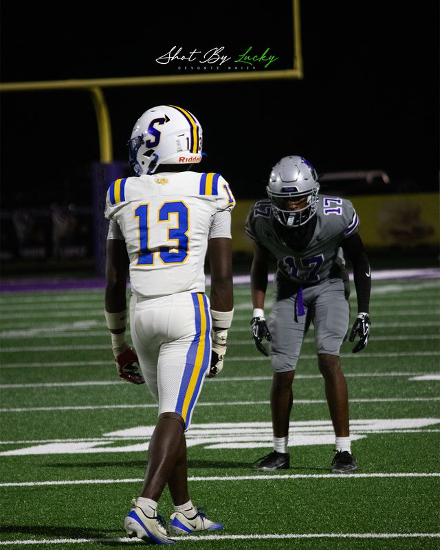 Two players facing off across the line