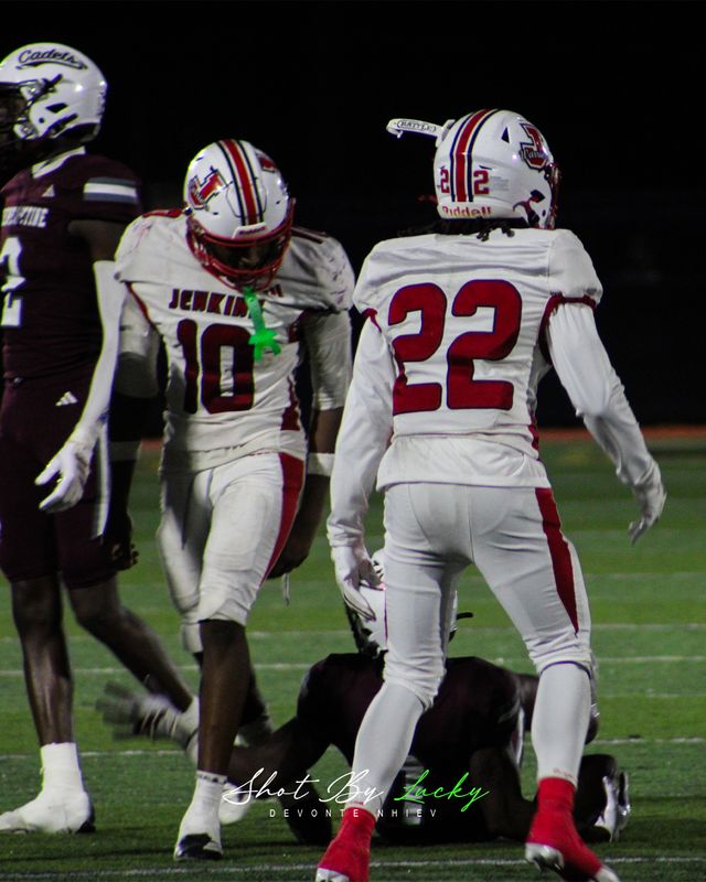Team mates walking back up the field together