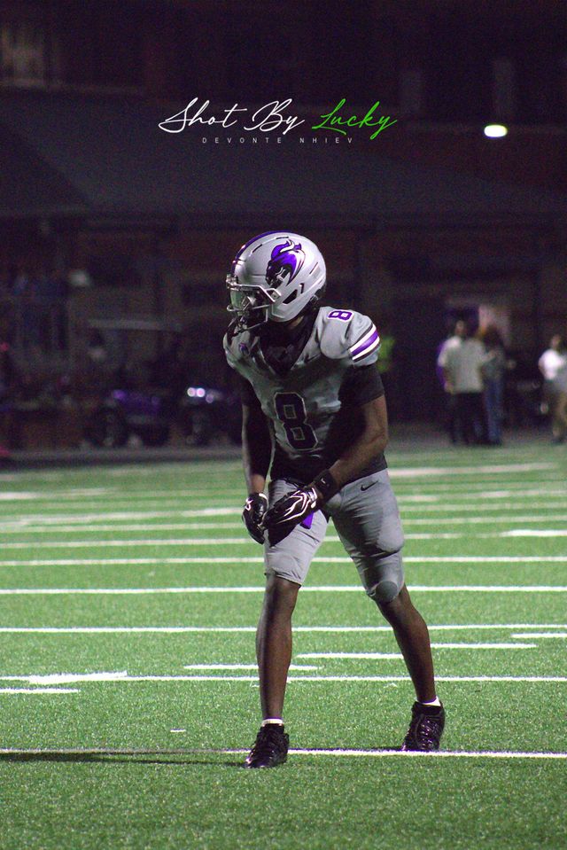 A receiver lining up wide, the field stretching away