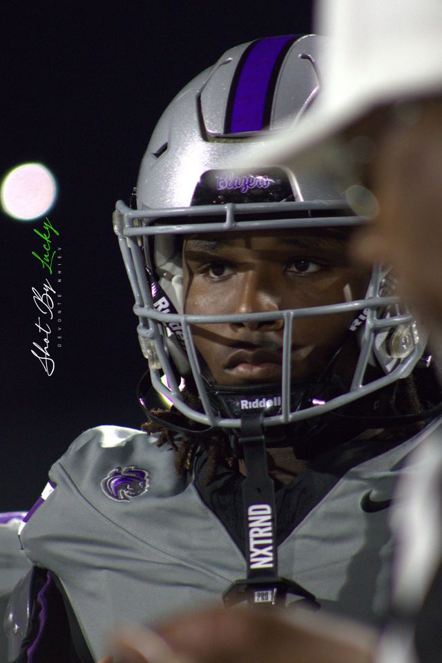 Close on a player in his helmet between plays